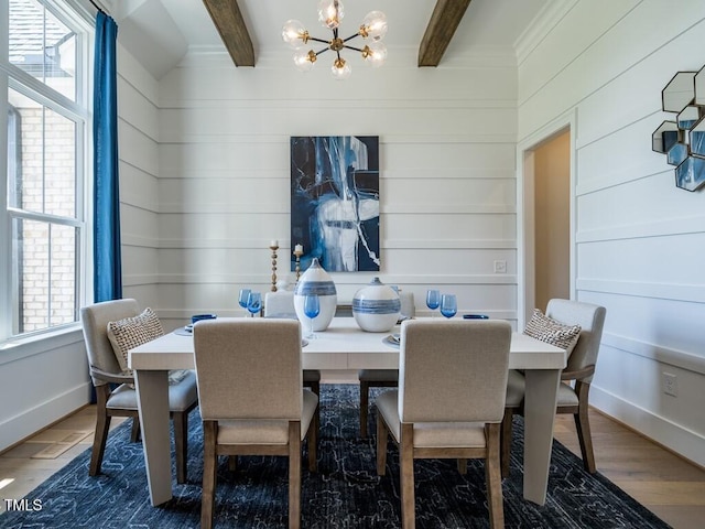 dining room featuring dark hardwood / wood-style floors, beamed ceiling, and an inviting chandelier