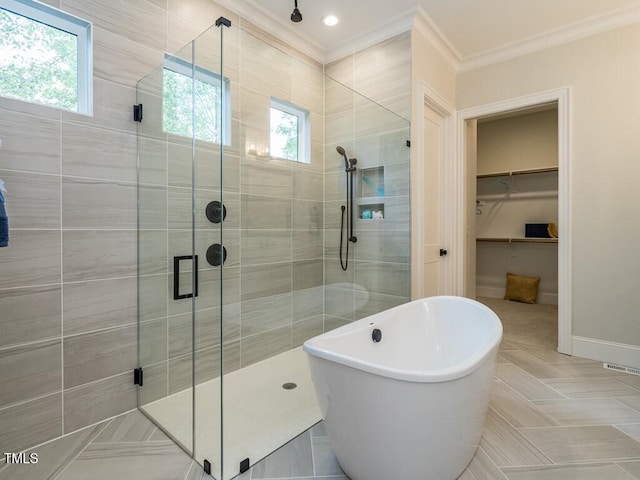 bathroom featuring ornamental molding, shower with separate bathtub, and tile patterned floors