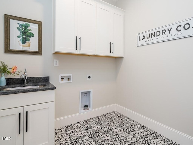 laundry area featuring light tile patterned flooring, sink, hookup for a washing machine, hookup for an electric dryer, and cabinets