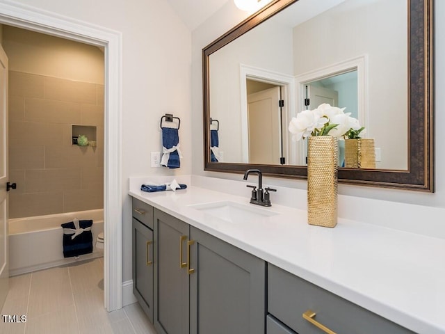 bathroom featuring toilet, tile patterned floors, and vanity