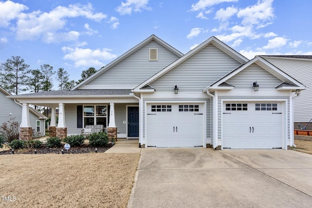 craftsman inspired home with covered porch and a garage