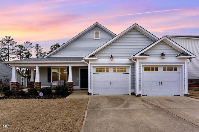 craftsman house featuring a garage and covered porch