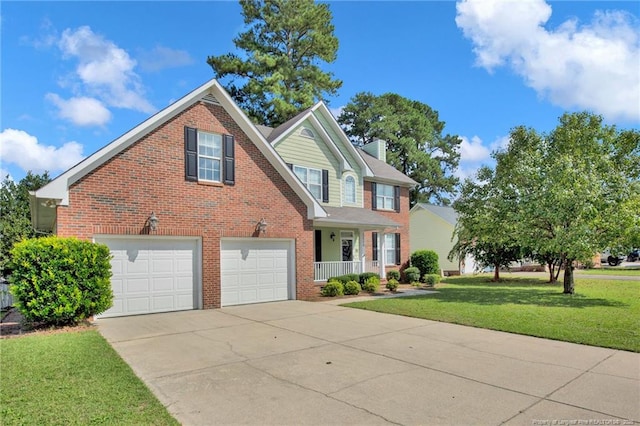 view of front of house with a front yard and a garage