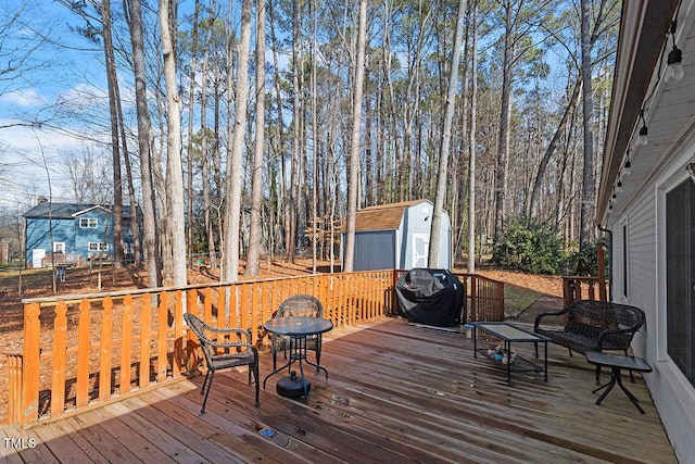 wooden terrace with a storage shed