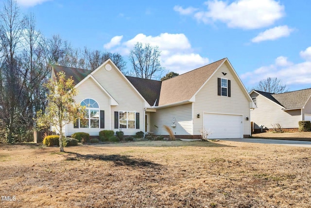 front facade with a garage and a front lawn