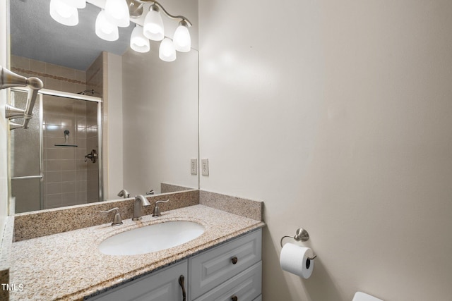 bathroom with vanity, toilet, and walk in shower