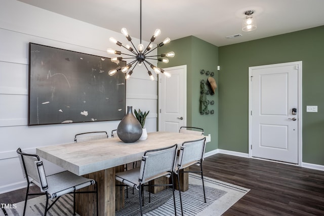 dining space featuring a notable chandelier and dark wood-type flooring