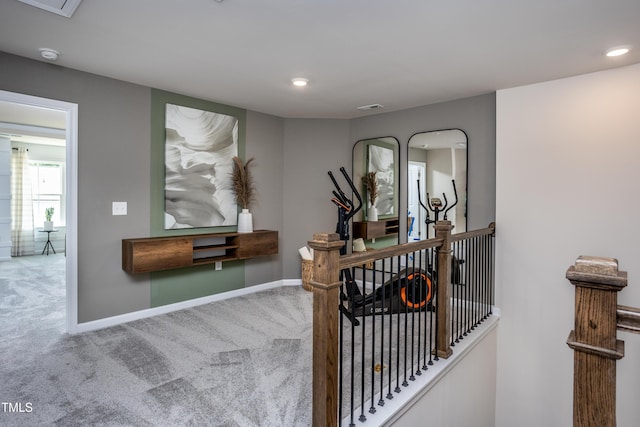 hallway with carpet flooring