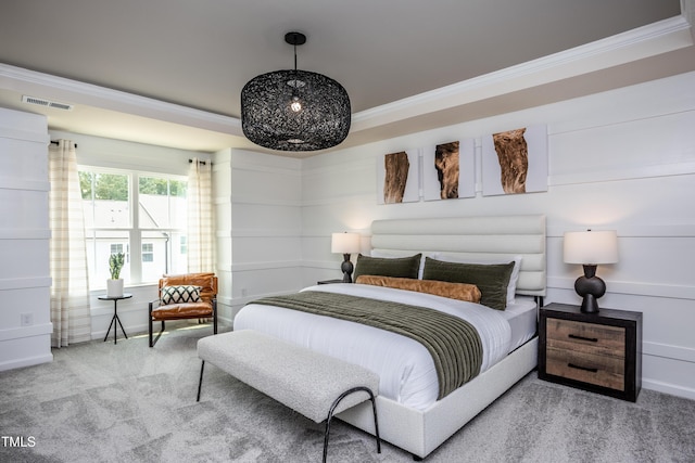 carpeted bedroom featuring crown molding