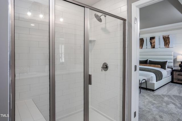 bathroom featuring a shower with shower door