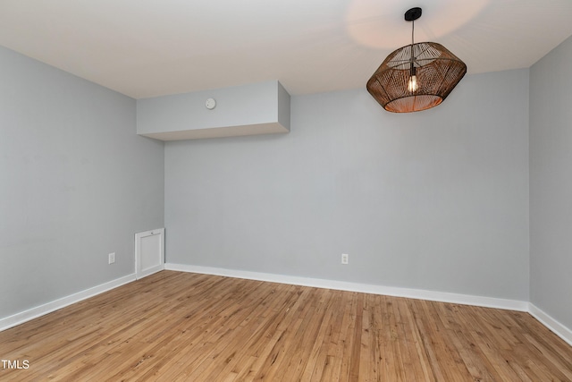 empty room with wood-type flooring