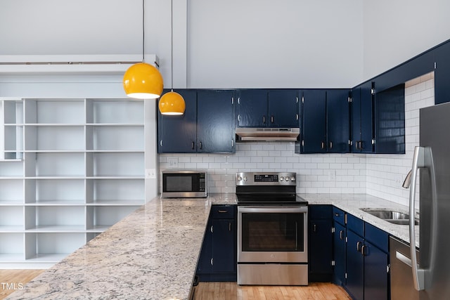 kitchen with stainless steel appliances, light stone counters, blue cabinets, backsplash, and pendant lighting