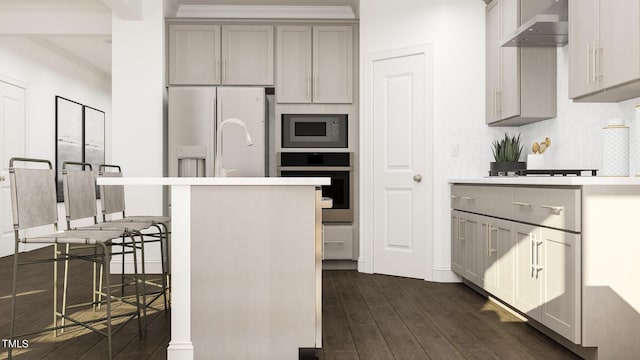 kitchen featuring wall chimney exhaust hood, gray cabinetry, built in microwave, white refrigerator with ice dispenser, and oven