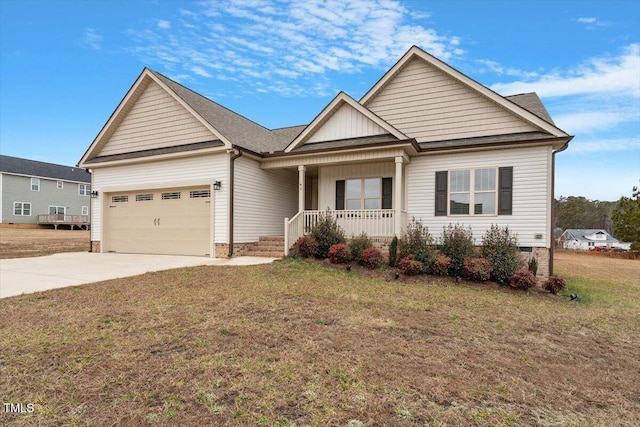 craftsman inspired home featuring a porch, a garage, and a front lawn