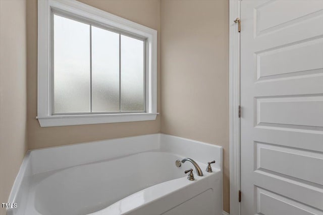 bathroom featuring a bath