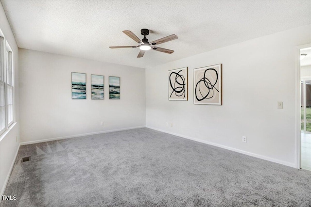 103 Val Del Ct, Garner, NC 27529 - empty room featuring a ceiling fan, carpet flooring, a textured ceiling, and baseboards