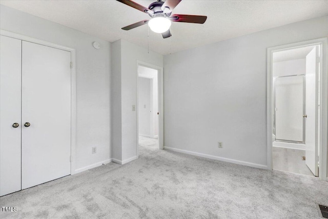 103 Val Del Ct, Garner, NC 27529 - unfurnished bedroom with carpet flooring, baseboards, connected bathroom, a closet, and a ceiling fan
