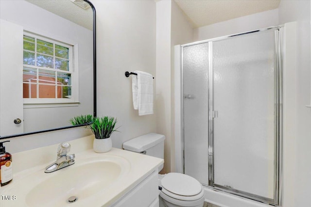 103 Val Del Ct, Garner, NC 27529 - full bathroom featuring a shower stall, vanity, toilet, and a textured ceiling
