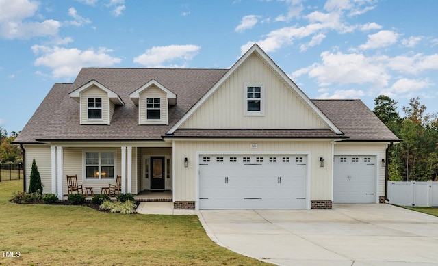 view of front of home with a front lawn and covered porch