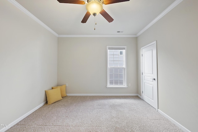 carpeted empty room featuring crown molding and ceiling fan