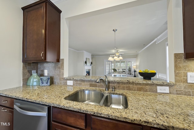 kitchen featuring sink, crown molding, dark brown cabinets, light stone countertops, and decorative backsplash