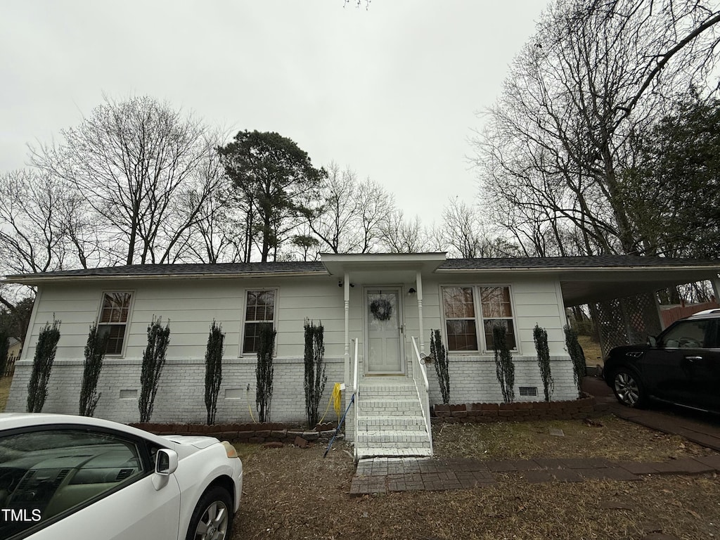 view of front of house featuring a carport