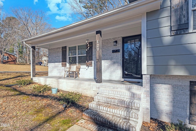 property entrance with covered porch