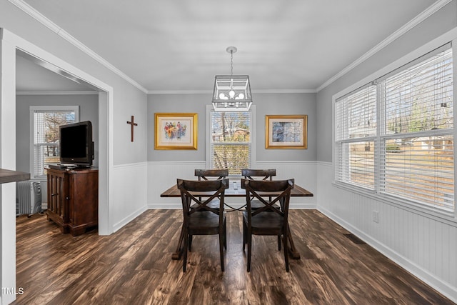 dining area with radiator, crown molding, and dark hardwood / wood-style floors