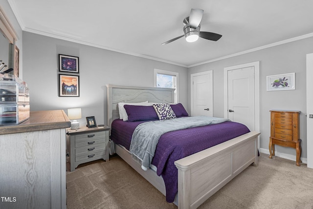 carpeted bedroom with ceiling fan and crown molding