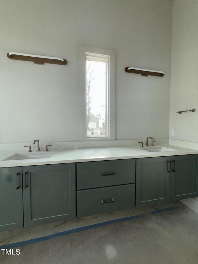 bathroom with vanity and concrete floors