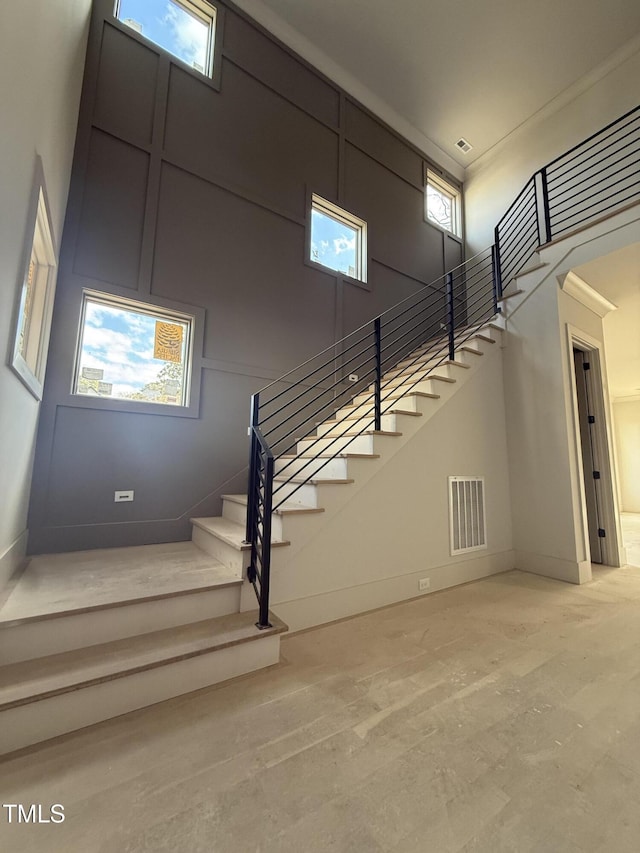 stairway with a towering ceiling