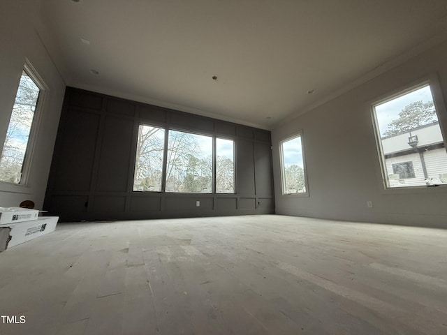 unfurnished room with ornamental molding