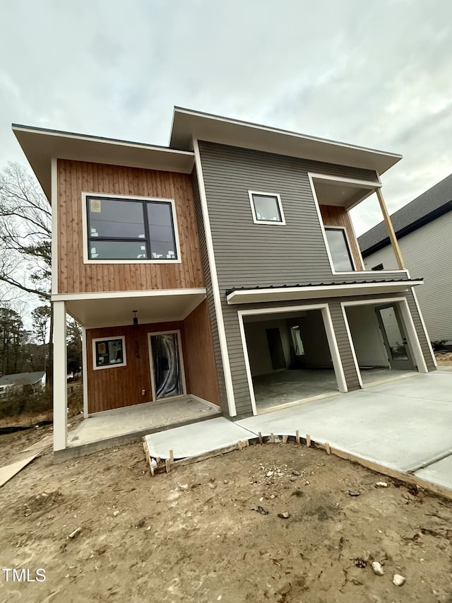 back of house with a garage