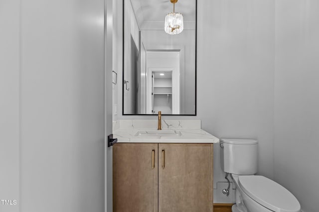 bathroom featuring toilet and vanity