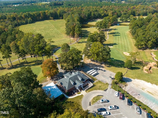 birds eye view of property with a wooded view