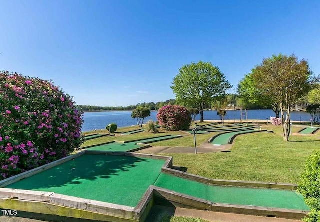 view of home's community featuring a yard and a water view