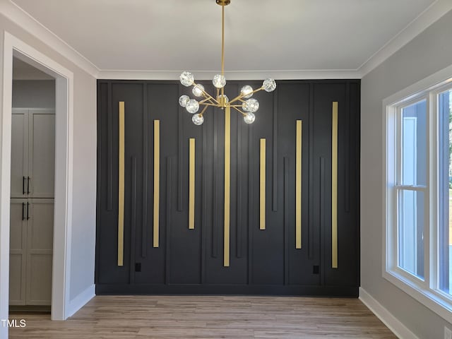 interior space featuring a chandelier, baseboards, and light wood-style floors