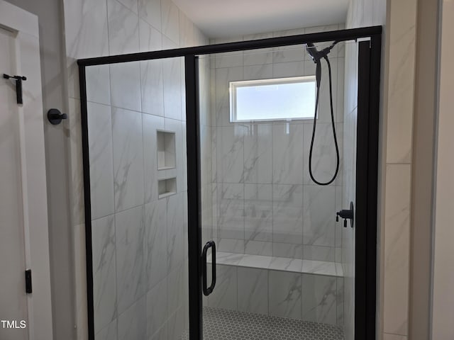 bathroom featuring a shower stall