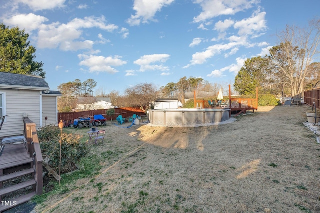 view of yard with a fenced in pool