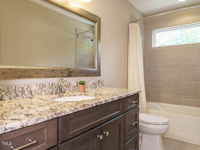 full bathroom featuring toilet, vanity, and shower / tub combo with curtain