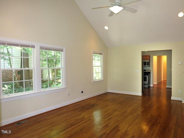 spare room with high vaulted ceiling, ceiling fan, and dark hardwood / wood-style floors