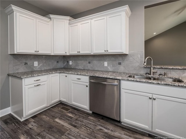 kitchen featuring light stone counters, dark hardwood / wood-style floors, sink, white cabinetry, and stainless steel dishwasher