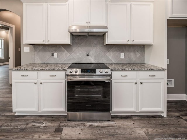 kitchen featuring light stone countertops, dark hardwood / wood-style floors, decorative backsplash, electric range, and white cabinetry