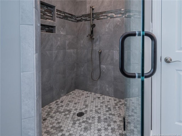 bathroom with a shower with shower door