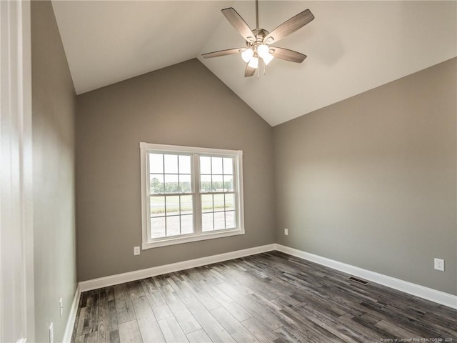 spare room featuring ceiling fan, vaulted ceiling, and dark hardwood / wood-style floors