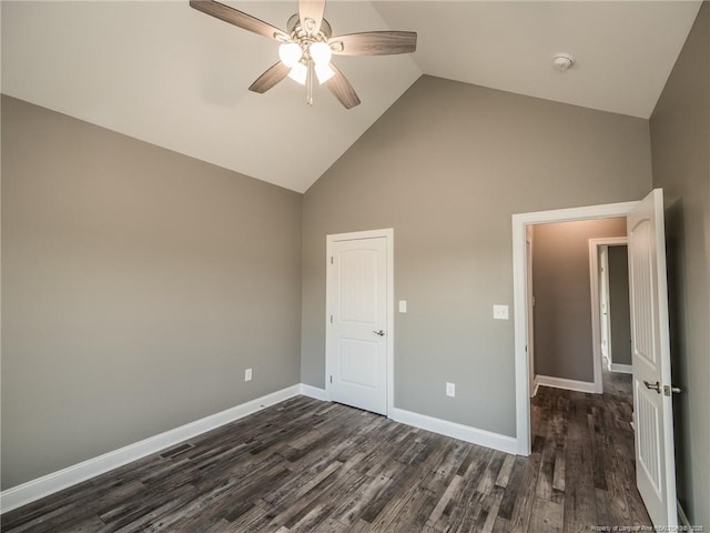 unfurnished bedroom with high vaulted ceiling, ceiling fan, and dark hardwood / wood-style floors