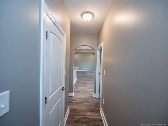 831 Norment Rd, Lumberton, NC 28360 - hall featuring baseboards, arched walkways, and dark wood-style floors