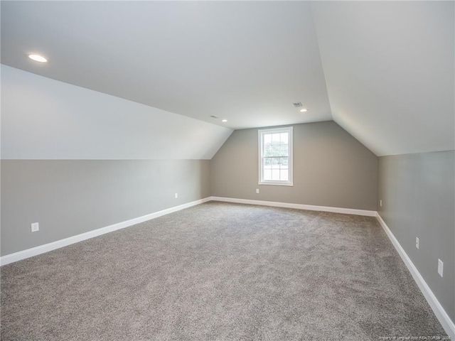 831 Norment Rd, Lumberton, NC 28360 - additional living space with visible vents, carpet, recessed lighting, baseboards, and vaulted ceiling