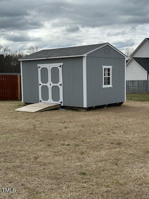 view of outdoor structure with a lawn