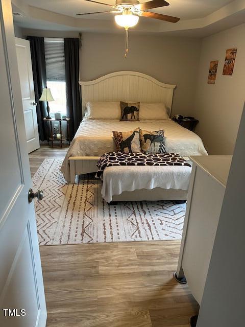 bedroom featuring light hardwood / wood-style flooring and ceiling fan